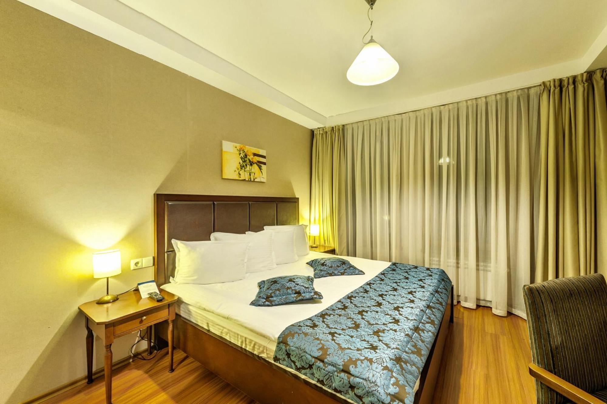 Regnum Bansko Ski Hotel & Spa Quarto foto A bedroom at the hotel